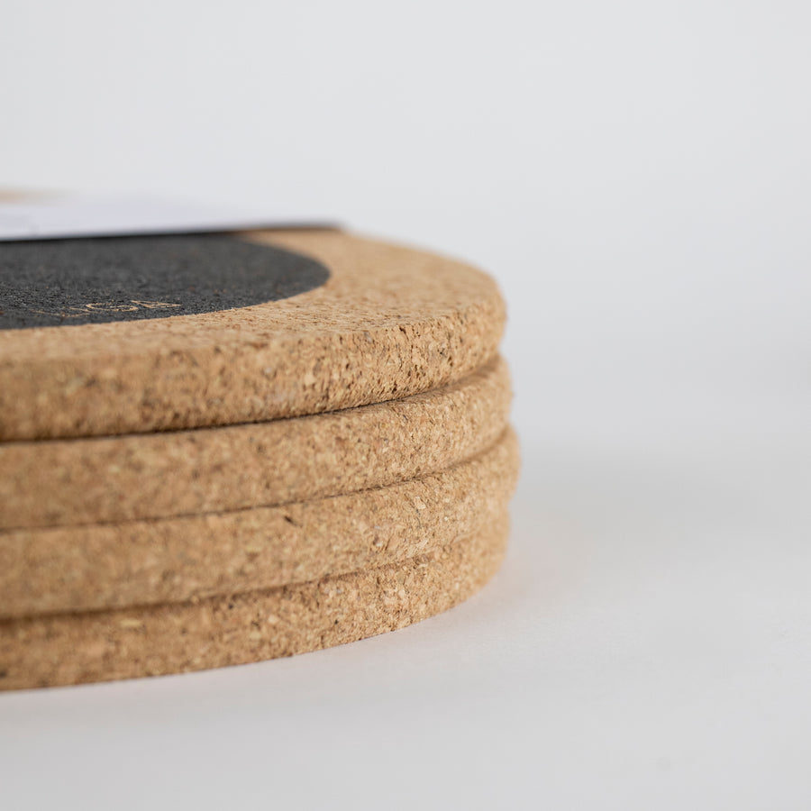 Eco friendly cork placemats + coasters. Black hole design