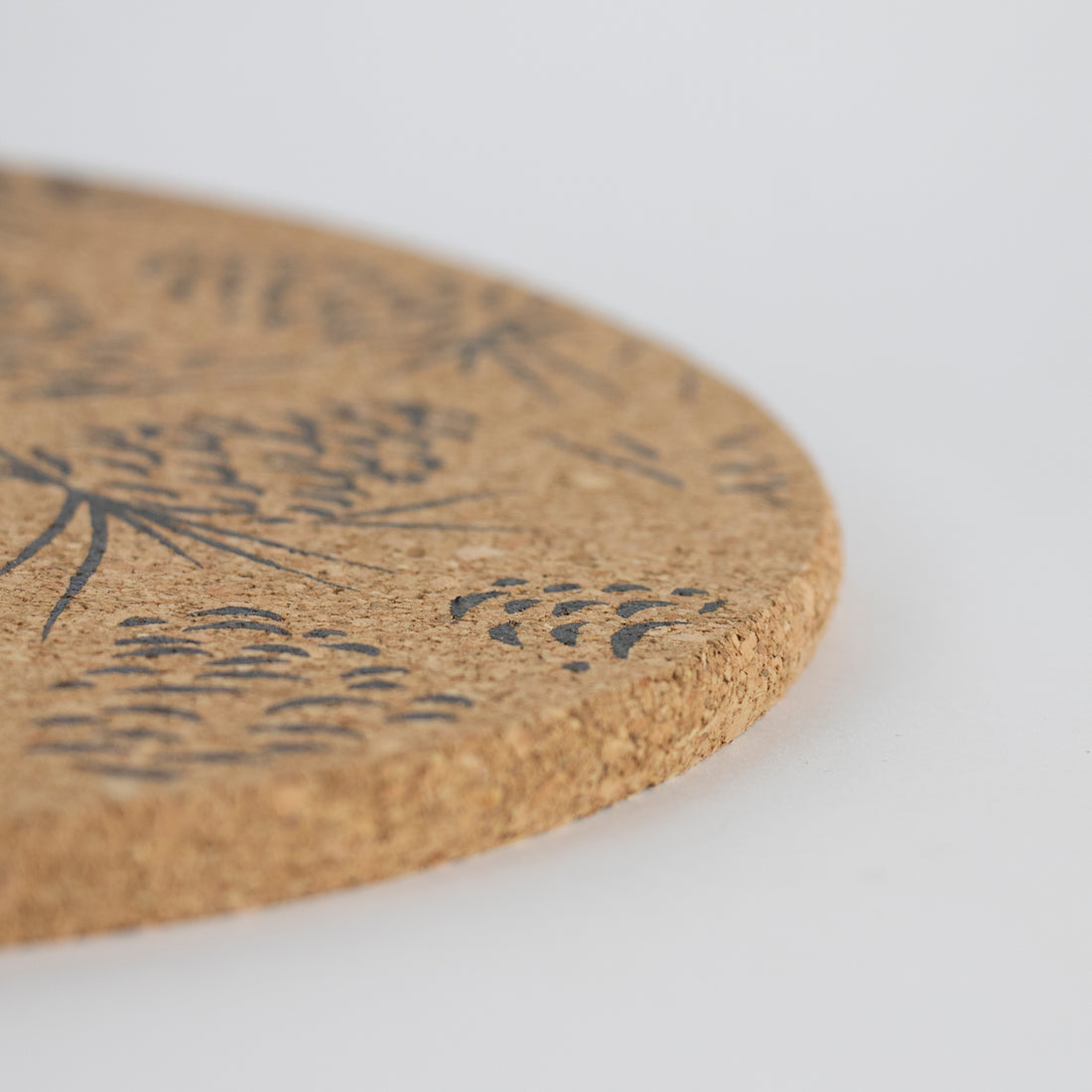 Sustainable cork placemat and coaster. Pinecone design