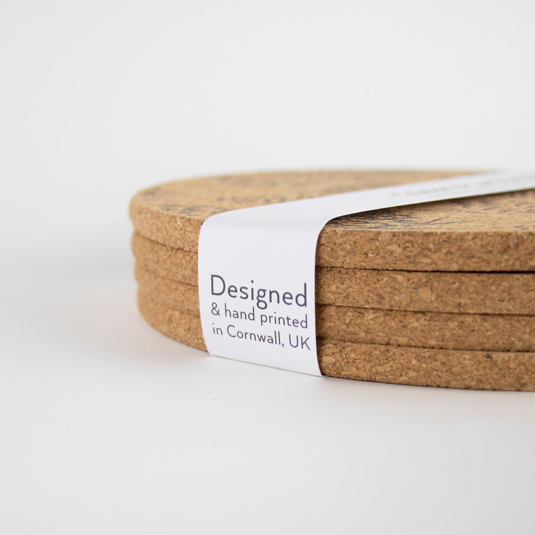 Sustainable cork placemat and coaster. Pinecone design