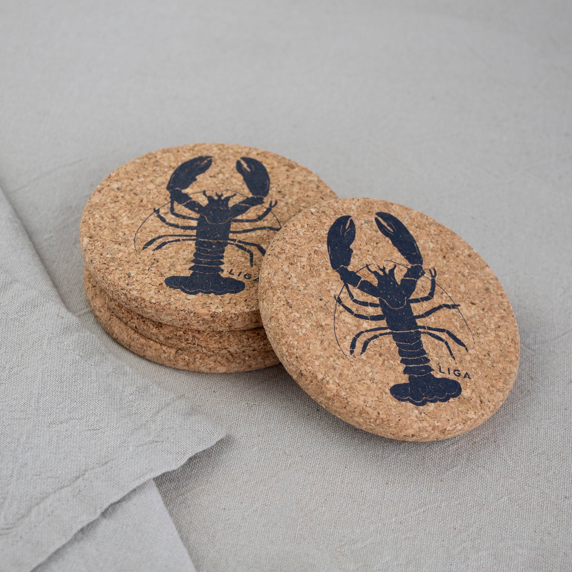cork coasters with grey lobster design