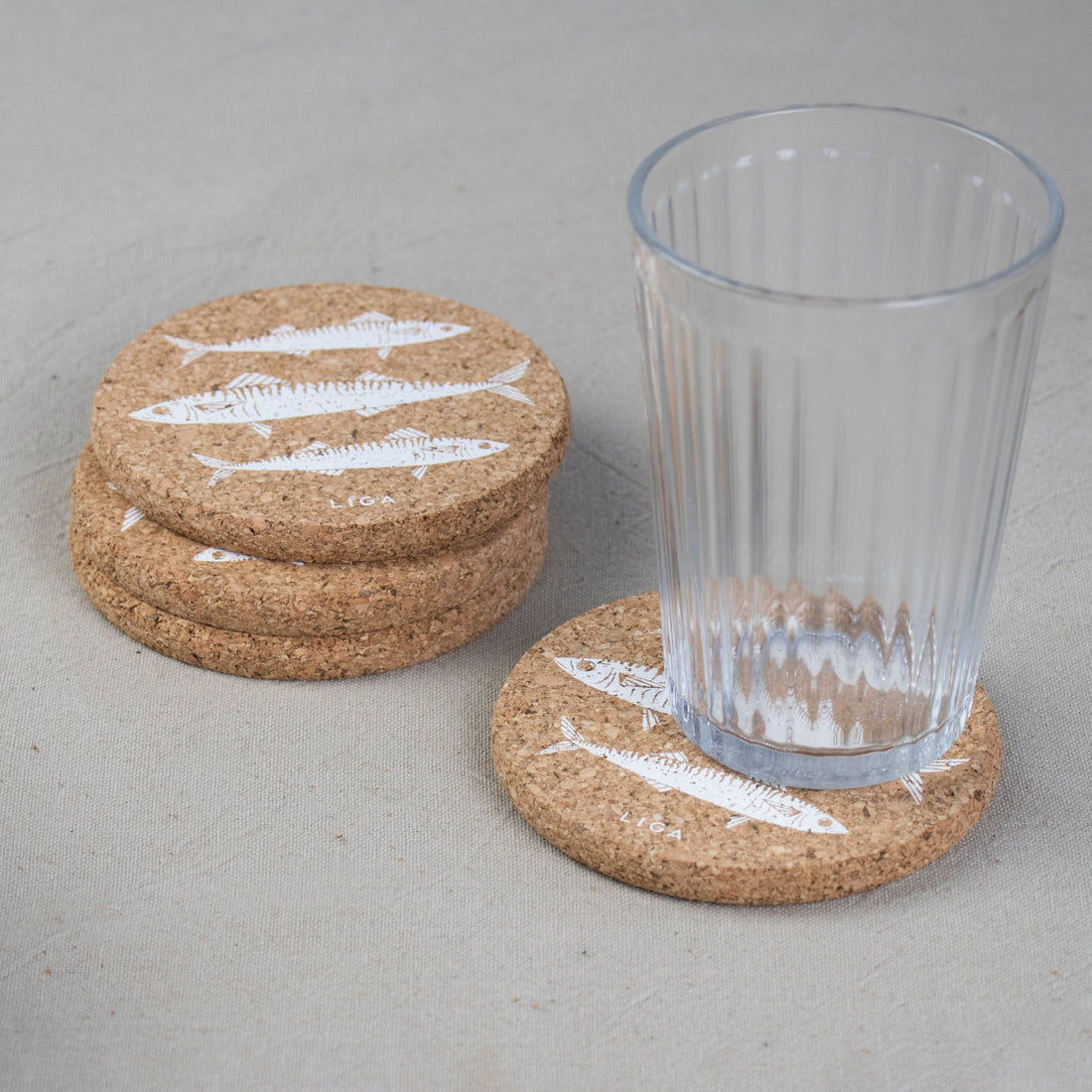 cork coaster with mackerel design and glass