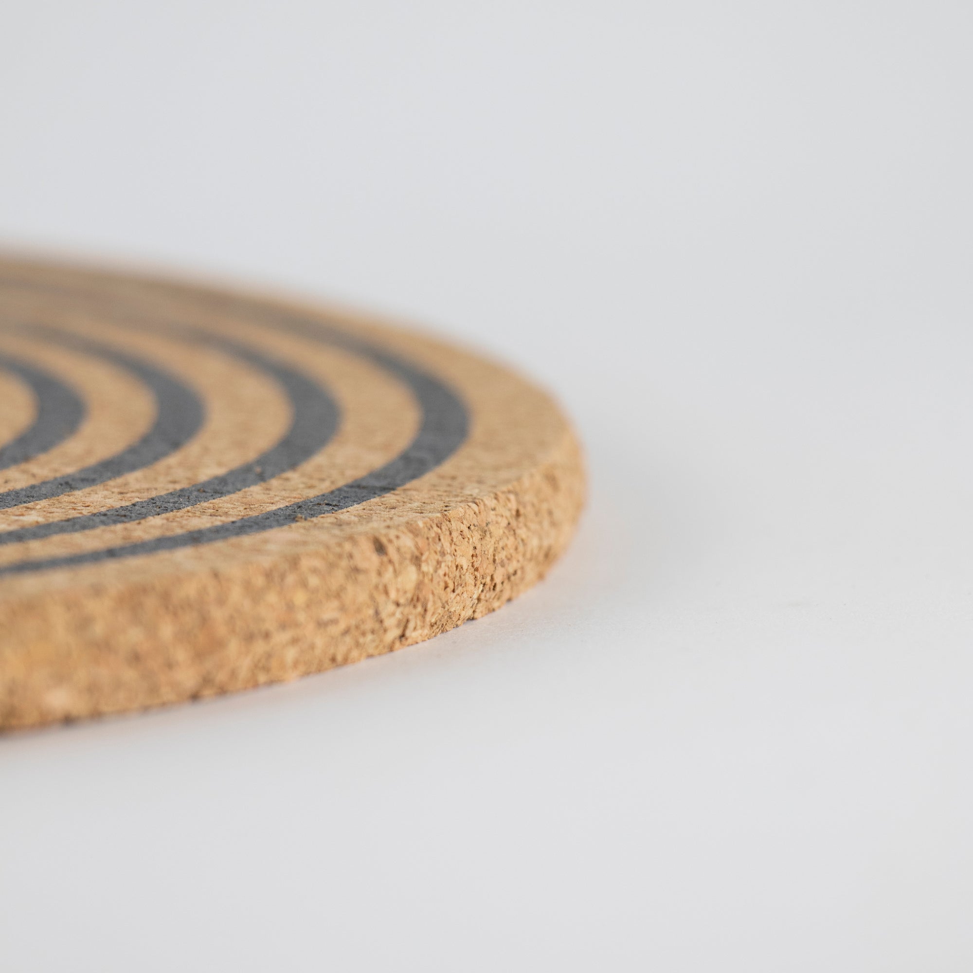 Sustainable cork placemat and coaster. Orbit design