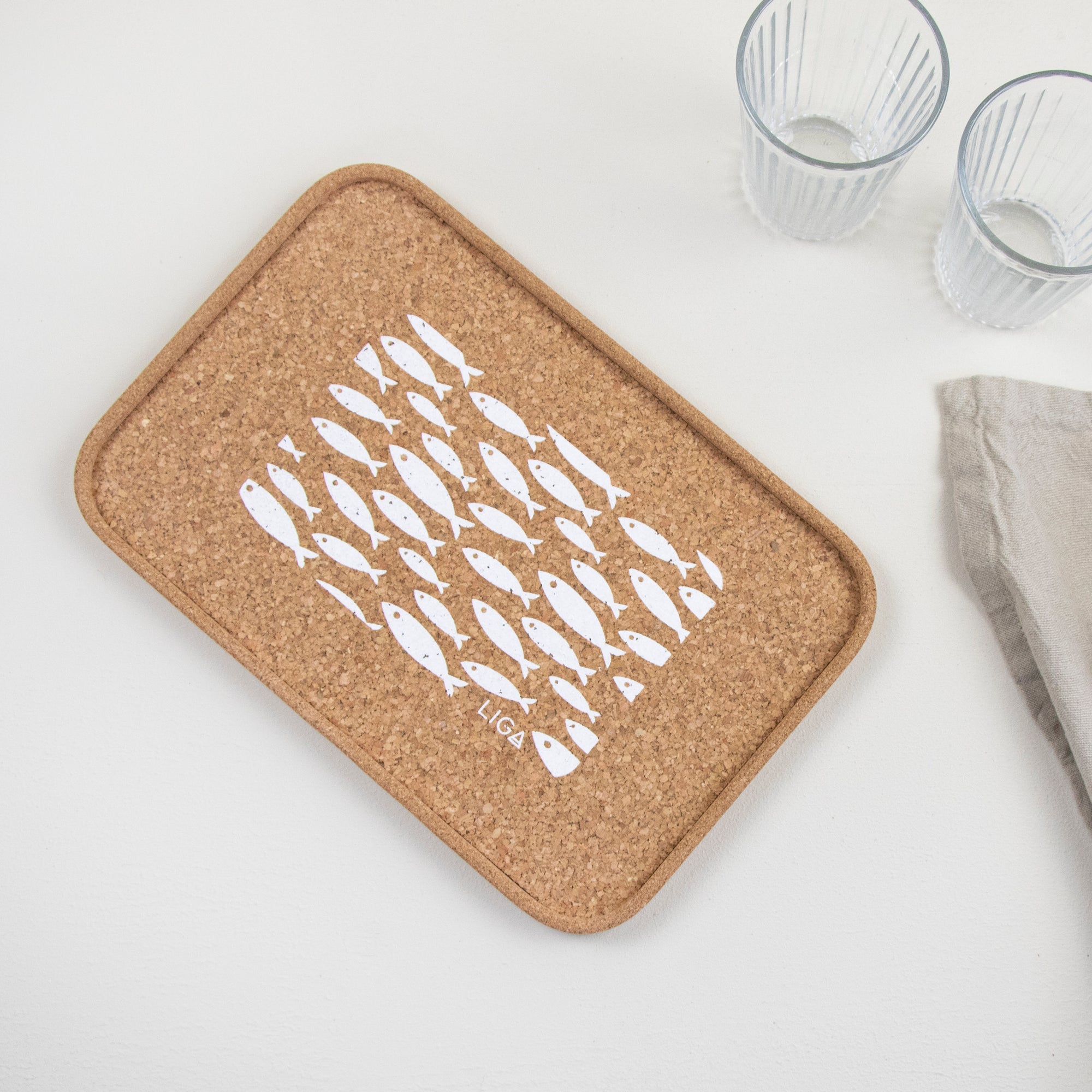 cork tray with white fish design