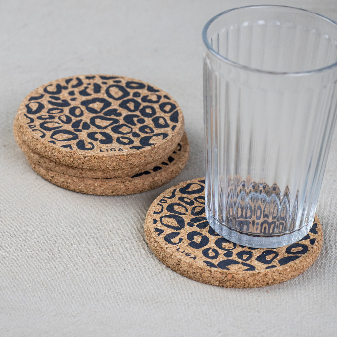 cork coaster with leopard print with glass