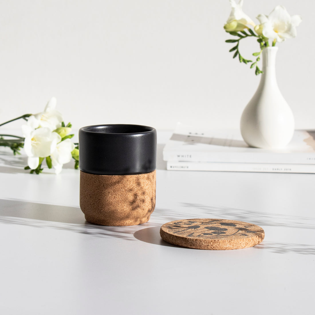 matt black mug with wildflower cork coaster