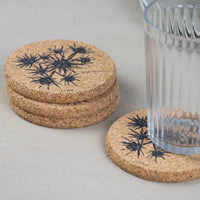 cork coaster with sea holly design and glass